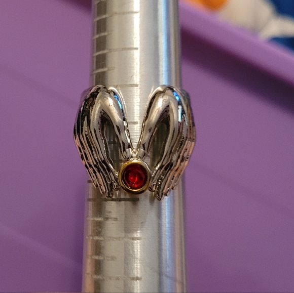 Hands holding stone ring - Picture 1 of 4